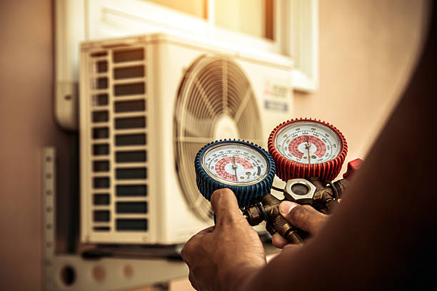 Professional Air Conditioning Service technician working in Gwynneville, IN